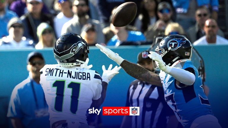 Seattle Seahawks wide receiver Jaxon Smith-Njigba (11) catches a touchdown pass ahead of Tennessee Titans safety Amani Hooker (37) during the first half of an NFL football game Sunday, Nov. 23, 2025, in Nashville, Tenn. (AP Photo/John Amis)
