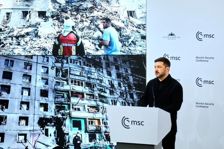 Ukraine's President Volodymyr Zelenskyy addresses the audience during a session at the Munich Security Conference in Munich, Germany, Saturday, Feb. 14, 2026. (AP Photo/Michael Probst)