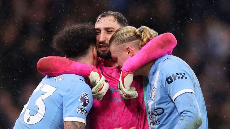 Man City players celebrate after holding on to beat Newcastle 2-1 