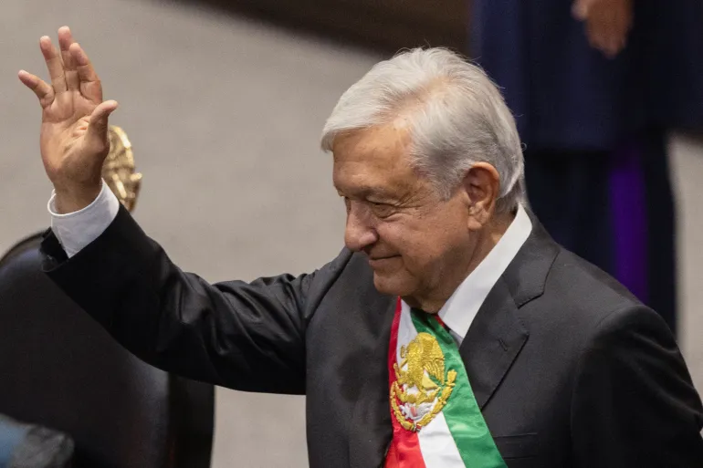 Mexico's President Andres Manuel Lopez Obrador gestures on the day of President-elect Claudia Sheinbaum's swearing in ceremon