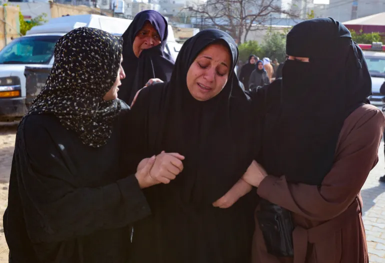 Mourners react during the funeral of Palestinians killed in an overnight Israeli strike, according to medics, at Nasser Hospital in Khan Younis in the southern Gaza Strip, February 15, 2026. REUTERS/Ramadan Abed TPX IMAGES OF THE DAY
