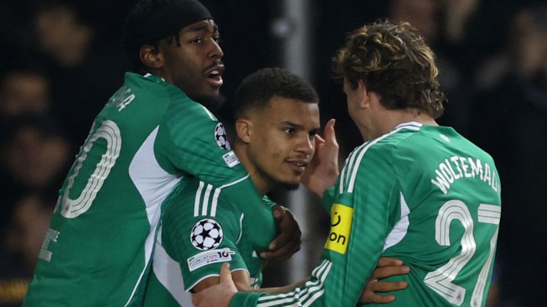 Newcastle United's German defender #12 Malick Thiaw celebrates with teammates after scoring