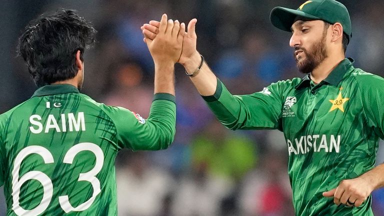 Pakistan's Saim Ayub, left, and captain Salman Ali Agha celebrate the wicket of India's Ishan Kishan during the T20 World Cup cricket match between India and Pakistan in Colombo, Sri Lanka, Sunday, Feb. 15, 2026. (AP Photo/Eranga Jayawardena)