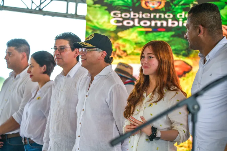 Gloria Miranda stands next to Gustavo Petro at an event