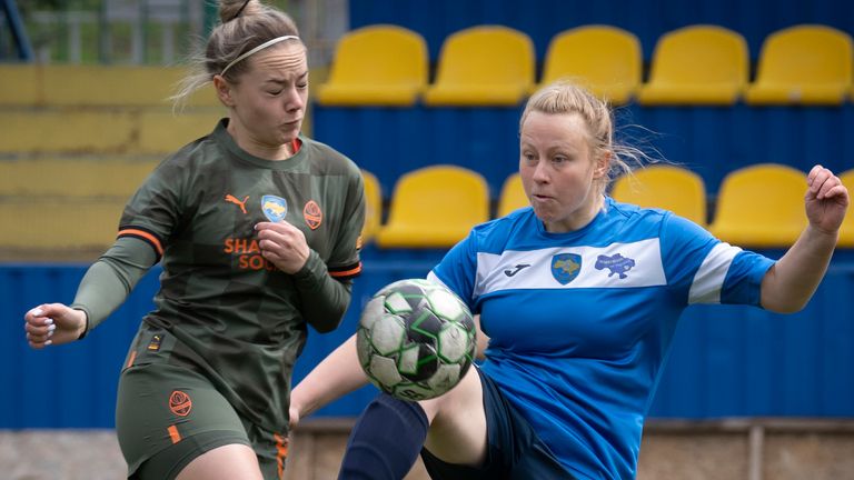 Players from Mariupol, right, and Shakhtar pictured in 2023 - some matches can last for four or five hours due to air raid sirens