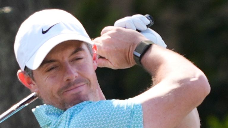 Rory McIlroy, of Northern Ireland, reacts while hitting practice shots during a practice round for The Players Championship golf