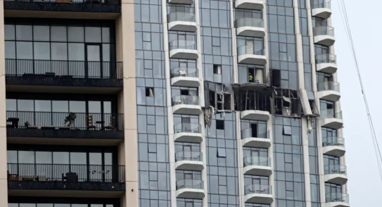 A view of the damaged part of the Dubai Creek Harbour Tower after it was hit by an Iranian drone attack in Dubai,