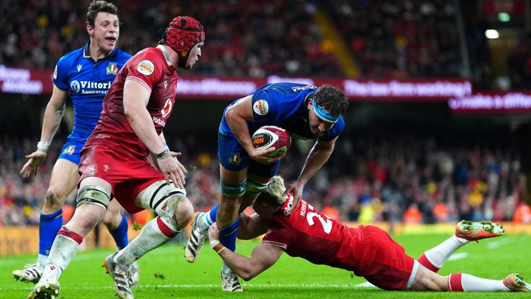 Italy's Michele Lamaro is tackled by Wales' Blair Murray