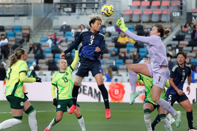 Japan defender Moeka Minami (3) headers in a goal past Australia goalkeeper Mackenzie Arnold (1) on a corner kick during the SheBelieves Cup women's soccer tournament, Thursday, Feb. 20, 2025, in Houston. (AP Photo/Michael Wyke)