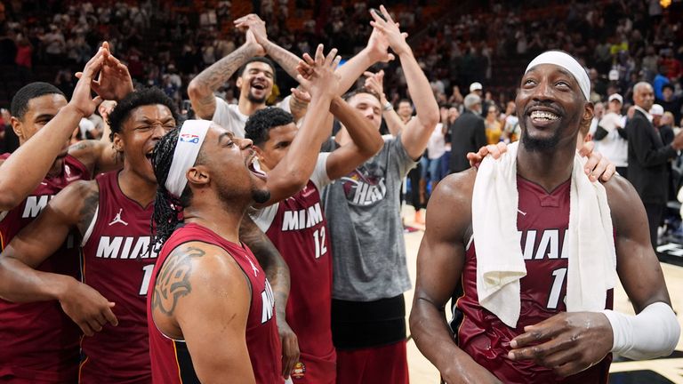 Miami Heat center Bam Adebayo, right, celebrates with teammates after he scored 83 points, the second-highest single game total in NBA history, in an NBA basketball game against the Washington Wizards, Tuesday, March 10, 2026, in Miami. (AP Photo/Rebecca Blackwell)
