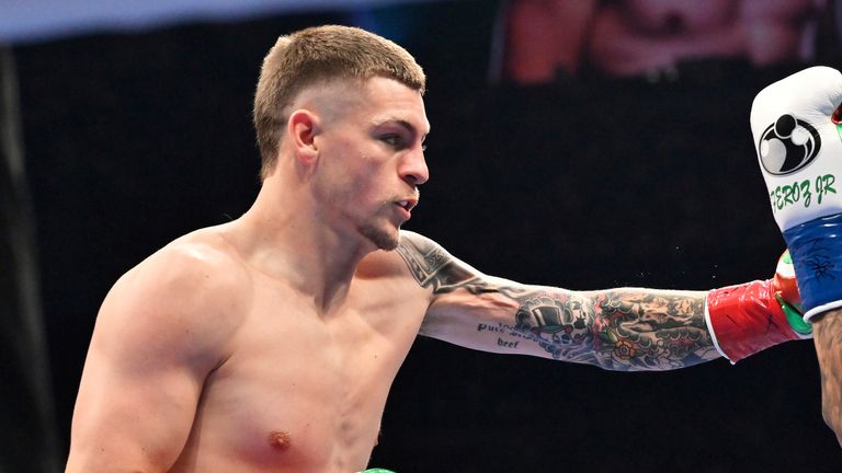 Callum Walsh, left, punches Fernando Vargas Jr. during a super welterweight boxing match h in Las Vegas, Saturday, Sept. 13, 2025. (AP Photo/David Becker)