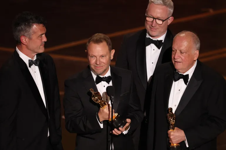 (From L) US visual effects supervisor Eric Saindon, US visual effects artist Richard Baneham, Daniel Barrett and US visual effects supervisor Joe Letteri accept the award for Best Visual Effects for "Avatar: Fire and Ash" onstage during the 98th Annual Academy Awards at the Dolby Theatre in Hollywood, California on March 15, 2026. (Photo by Patrick T. Fallon / AFP)