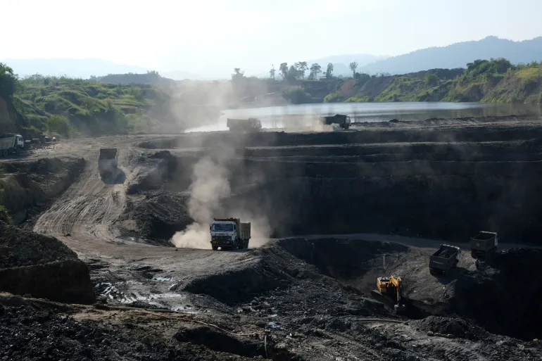 FILE - Machineries work at an open pit coal mining site in Tiru valley of Wokha district, in the northeastern state of Nagaland, India, Dec. 15, 2021. (AP Photo/Yirmiyan Arthur, File)