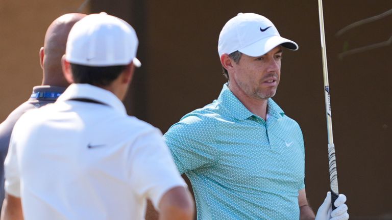 Rory McIlroy, of Northern Ireland, reacts while hitting practice shots during a practice round for The Players Championship 