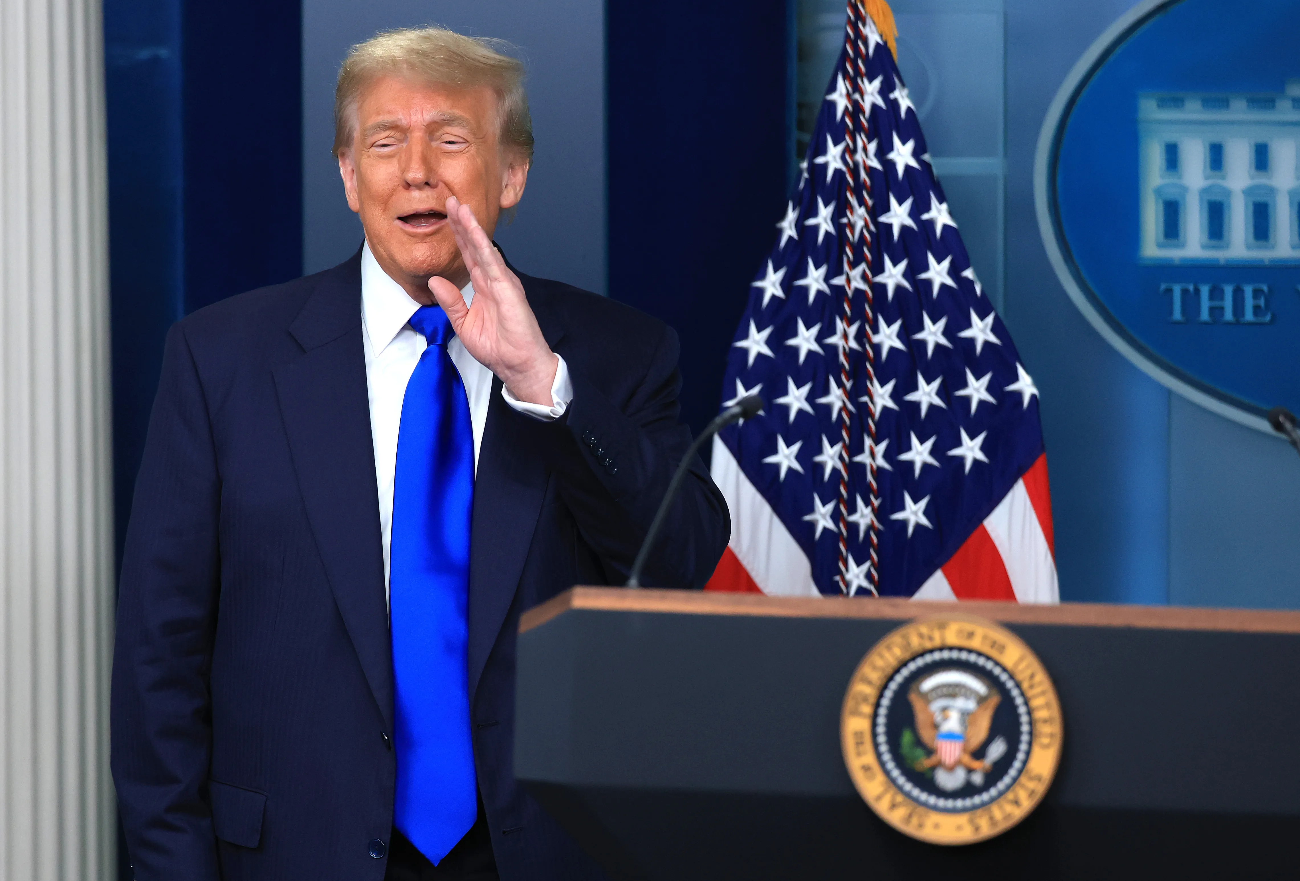 Trump at a podium in the White House