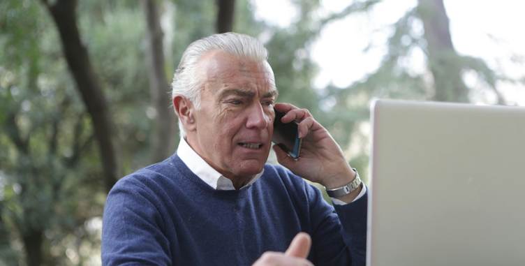 A person on the phone
Description automatically generated