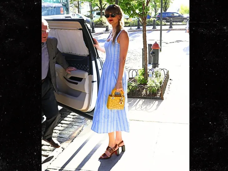 Taylor and her dad and friend Ashley out in NYC today backgrid