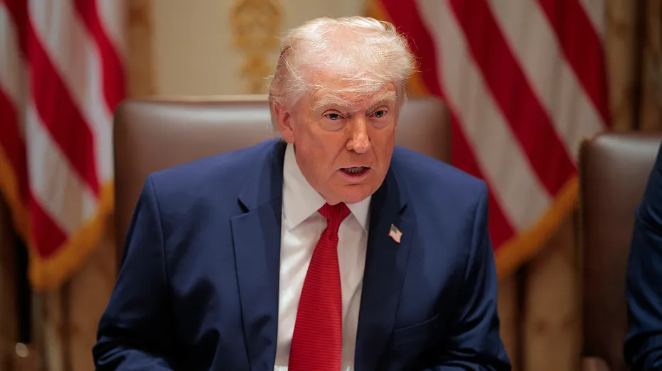 Trump is seen answering a reporters question in the White House.