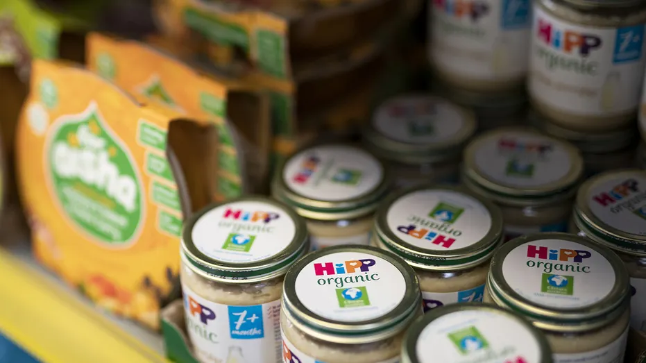 baby food stacked on grocery shelf
