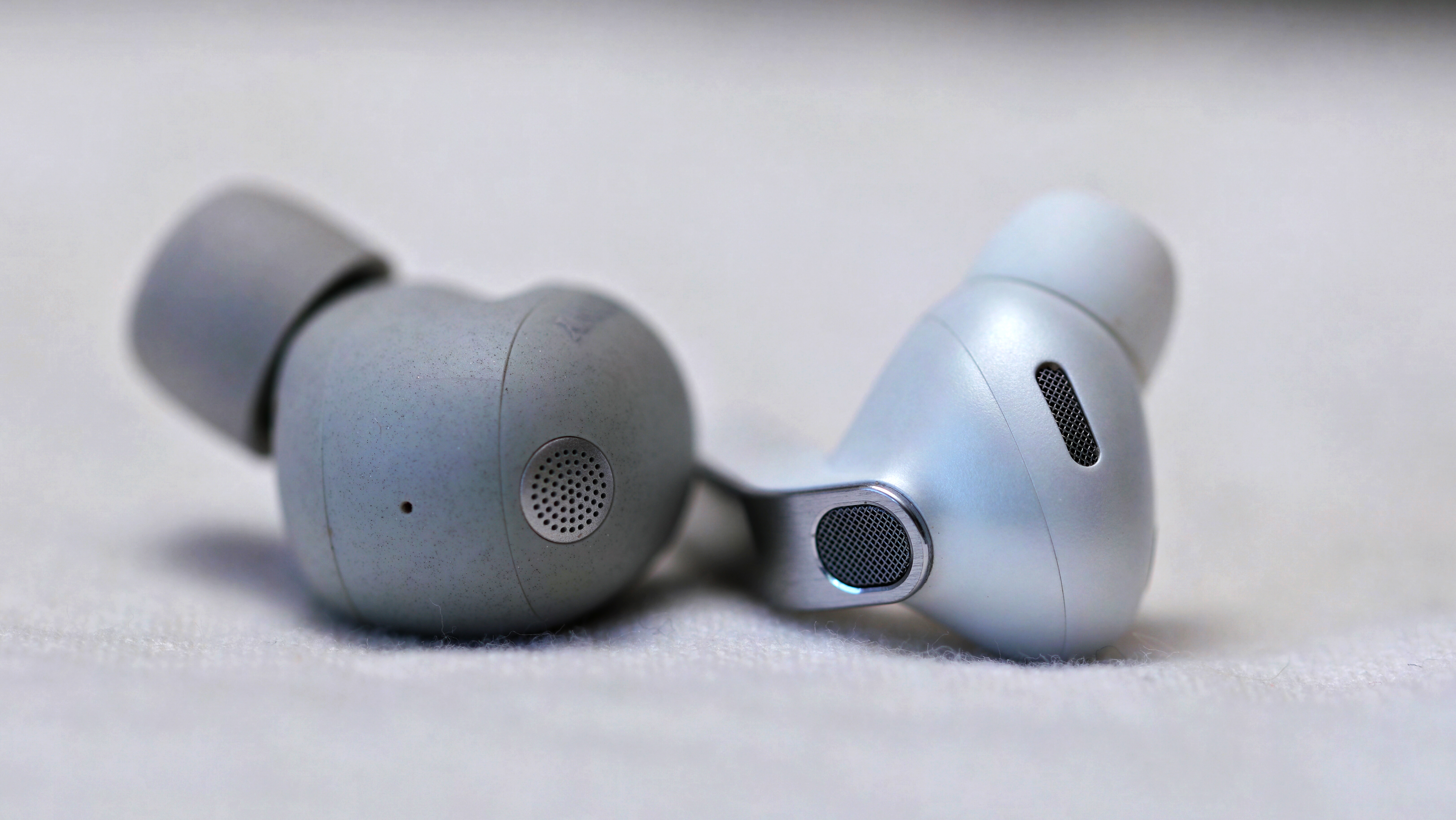 Sony WF-1000XM6 on the left, Samsung Galaxy Buds 4 Pro on the right
