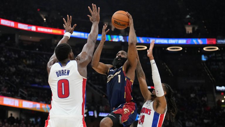Cleveland Cavaliers' James Harden (1) shoots between Detroit Pistons' Jalen Duren (0) and Daniss Jenkins (24)
