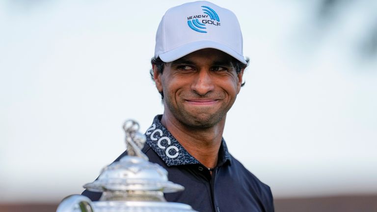 Aaron Rai, of England, looks past the Wanamaker Trophy after winning the PGA Championship 