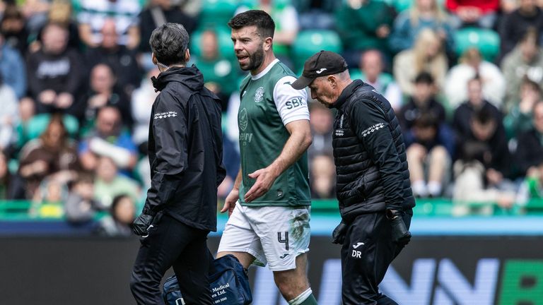Hibernian's Grant Hanley is substituted after going down injured 