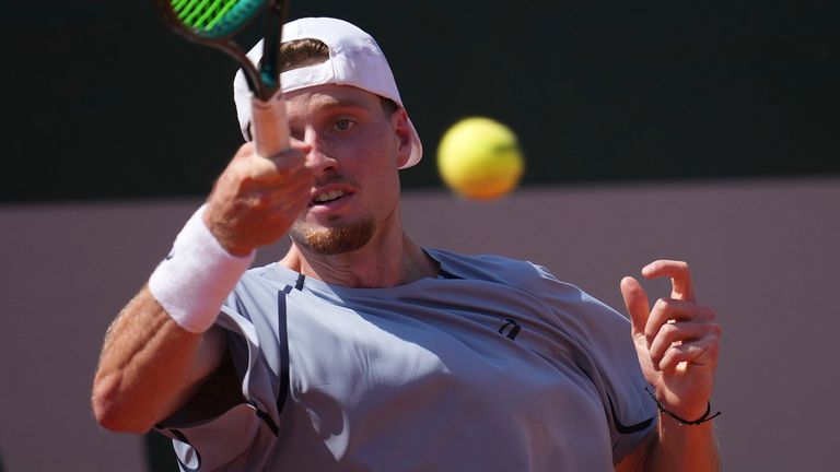 Toby Samuel of Britain returns to Alex De Minaur of Australia during their first round men's singles tennis match at the French Open tennis 