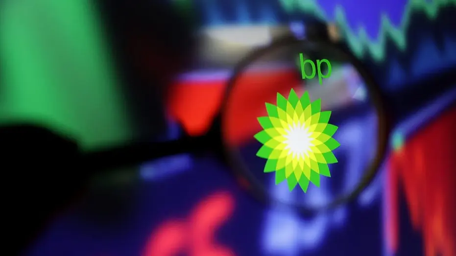BP Logo with stock charts in background