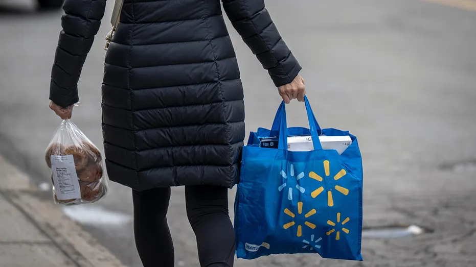 Shopper carries Walmart bag