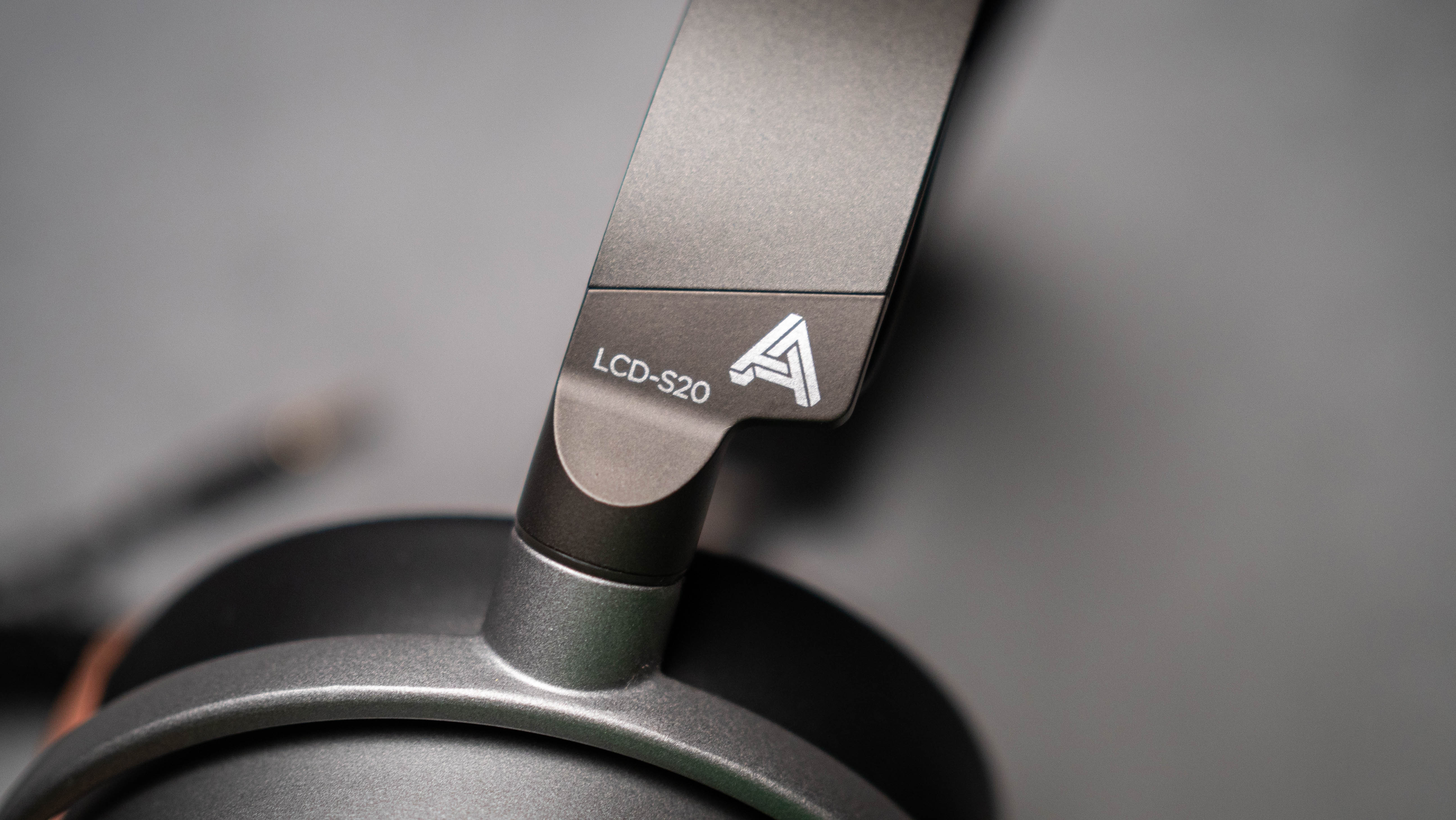 Audeze LCD-S20 planar headset against a grey craft sheet highlighting the product design