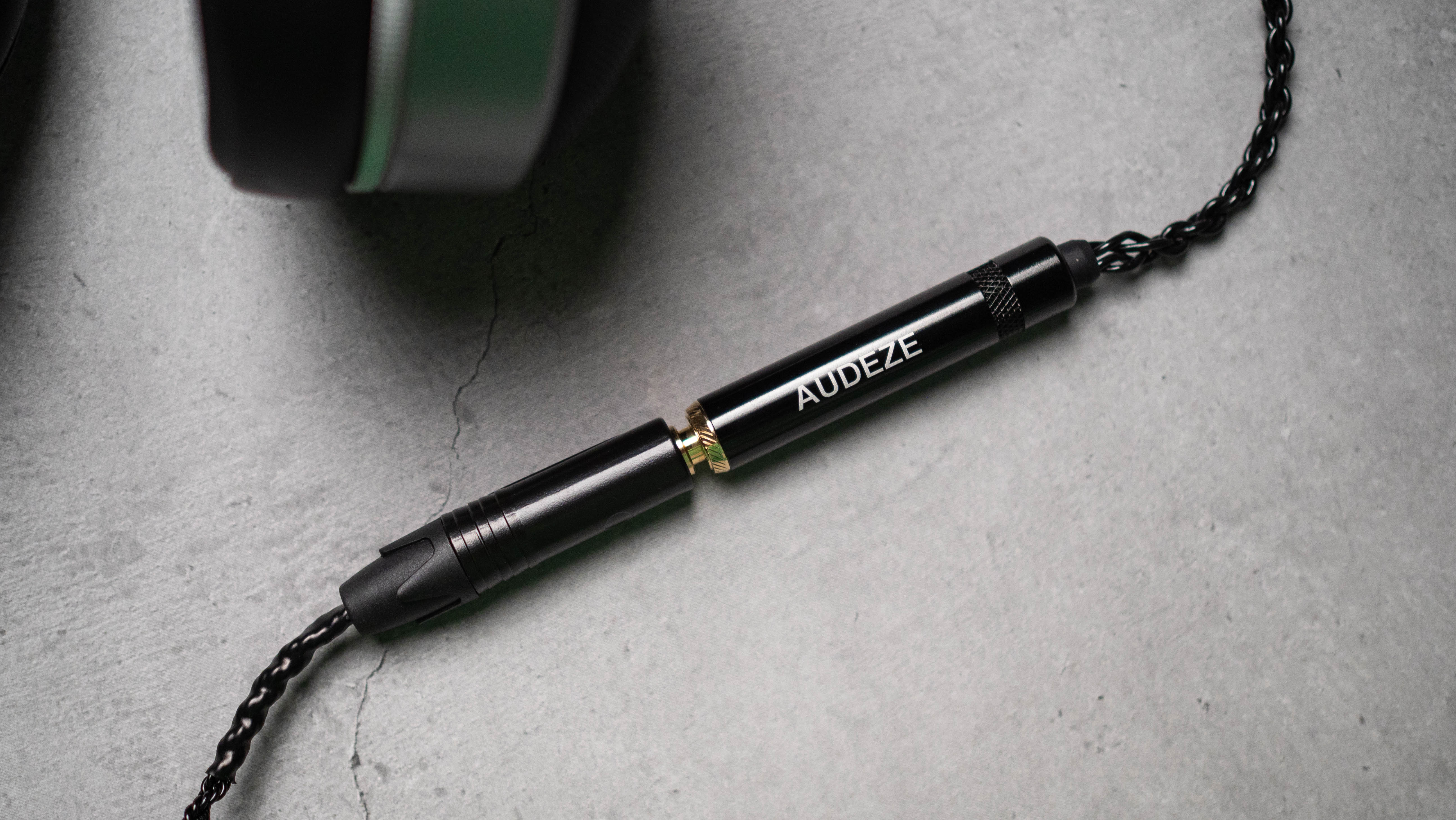 Audeze LCD-S20 planar headset against a grey craft sheet highlighting the product design
