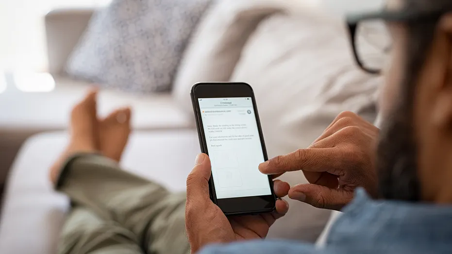 Man emails on phone