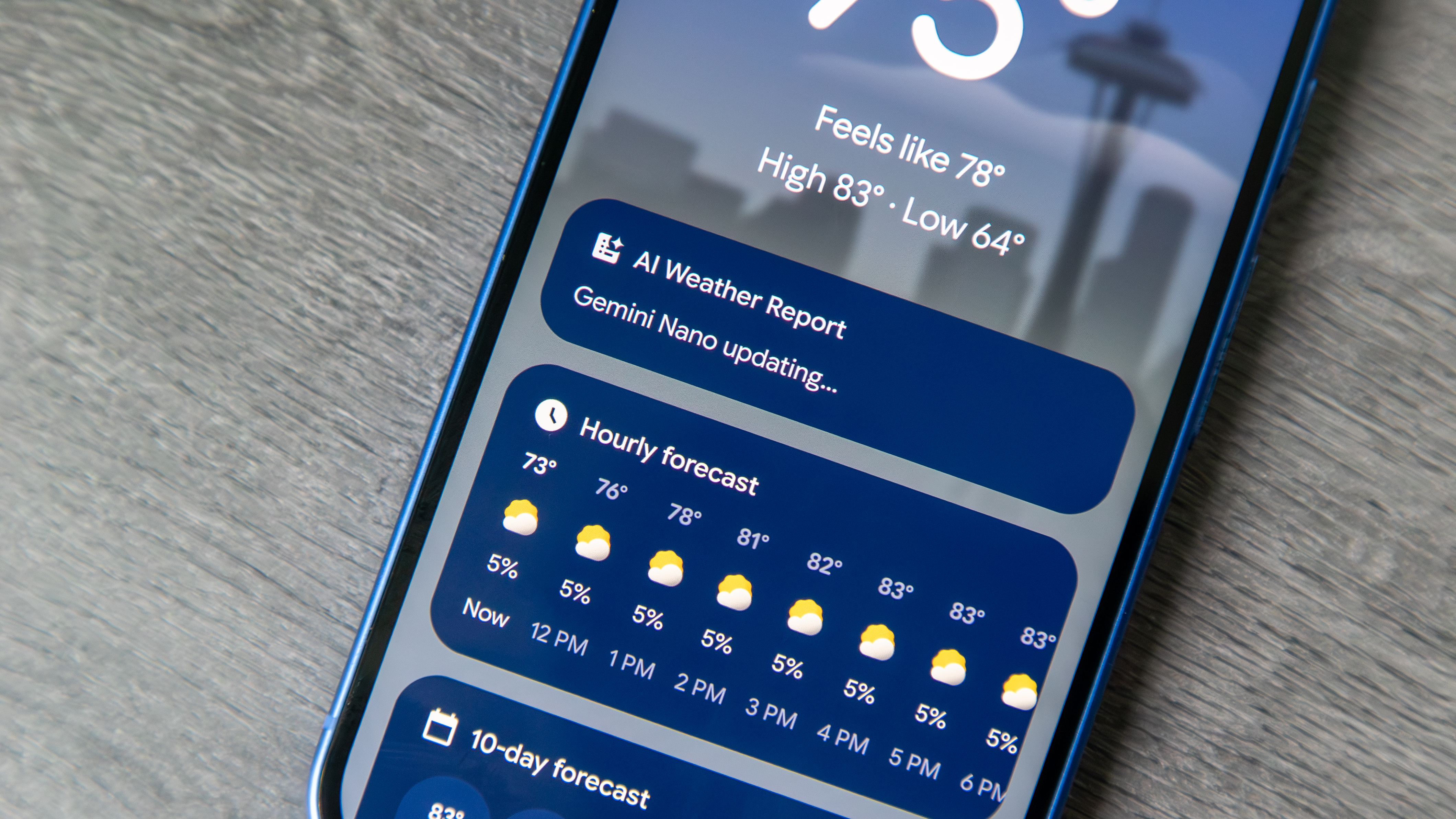 Pixel 10 Weather app with a "Gemini Nano updating" message