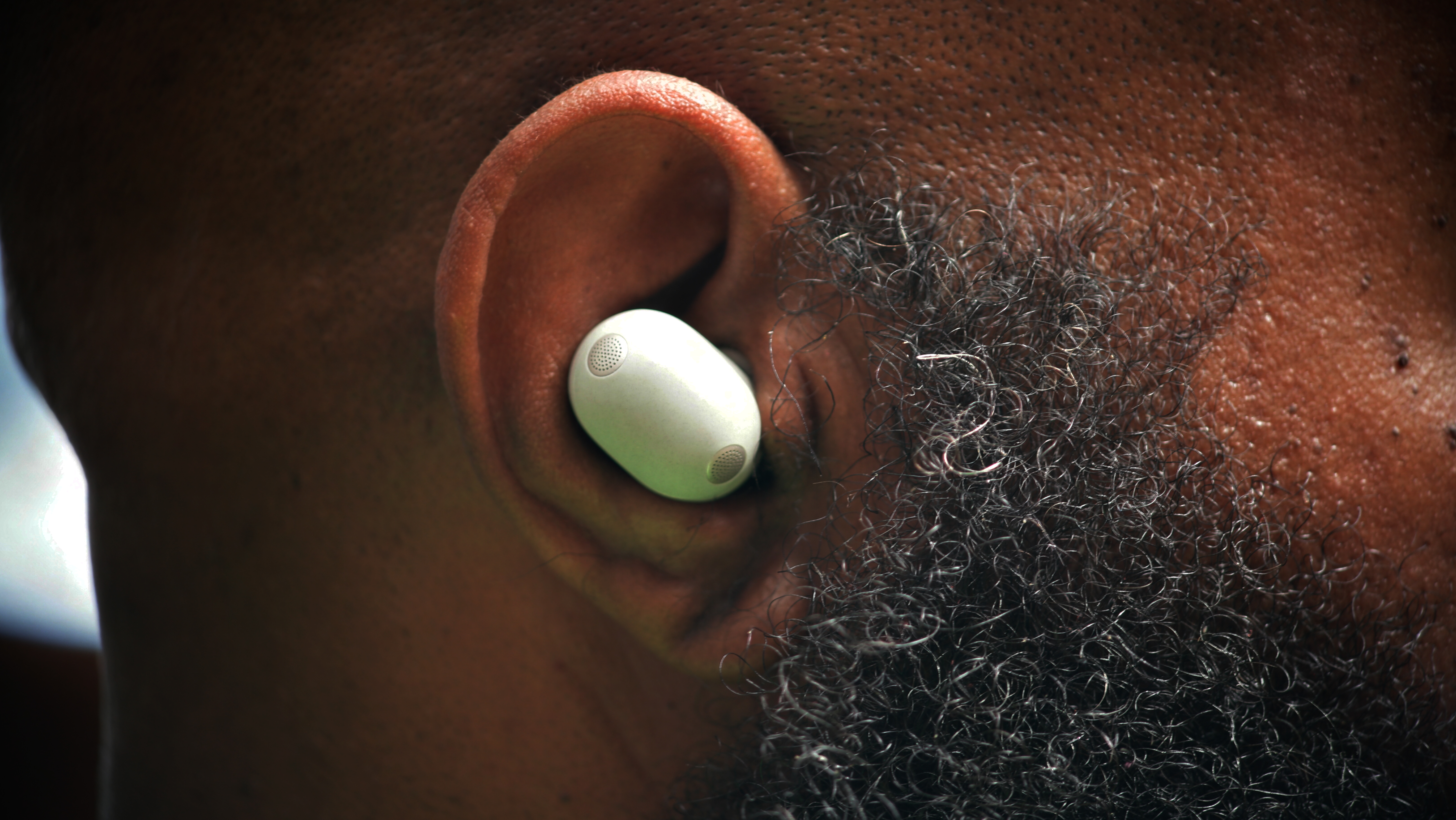 Sony WF-1000XM6 earbuds being worn by reviewer