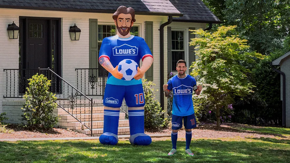 Lionel Messi next to 10-foot inflatable with Lowe's
