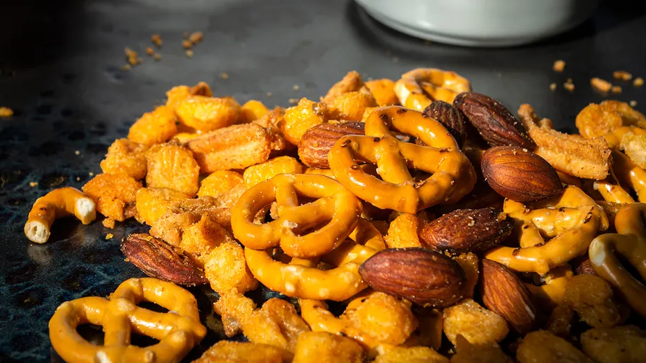 A close-up of a trail mix containing pretzels, almonds and crunchy snack pieces is shown in this undated photo.
