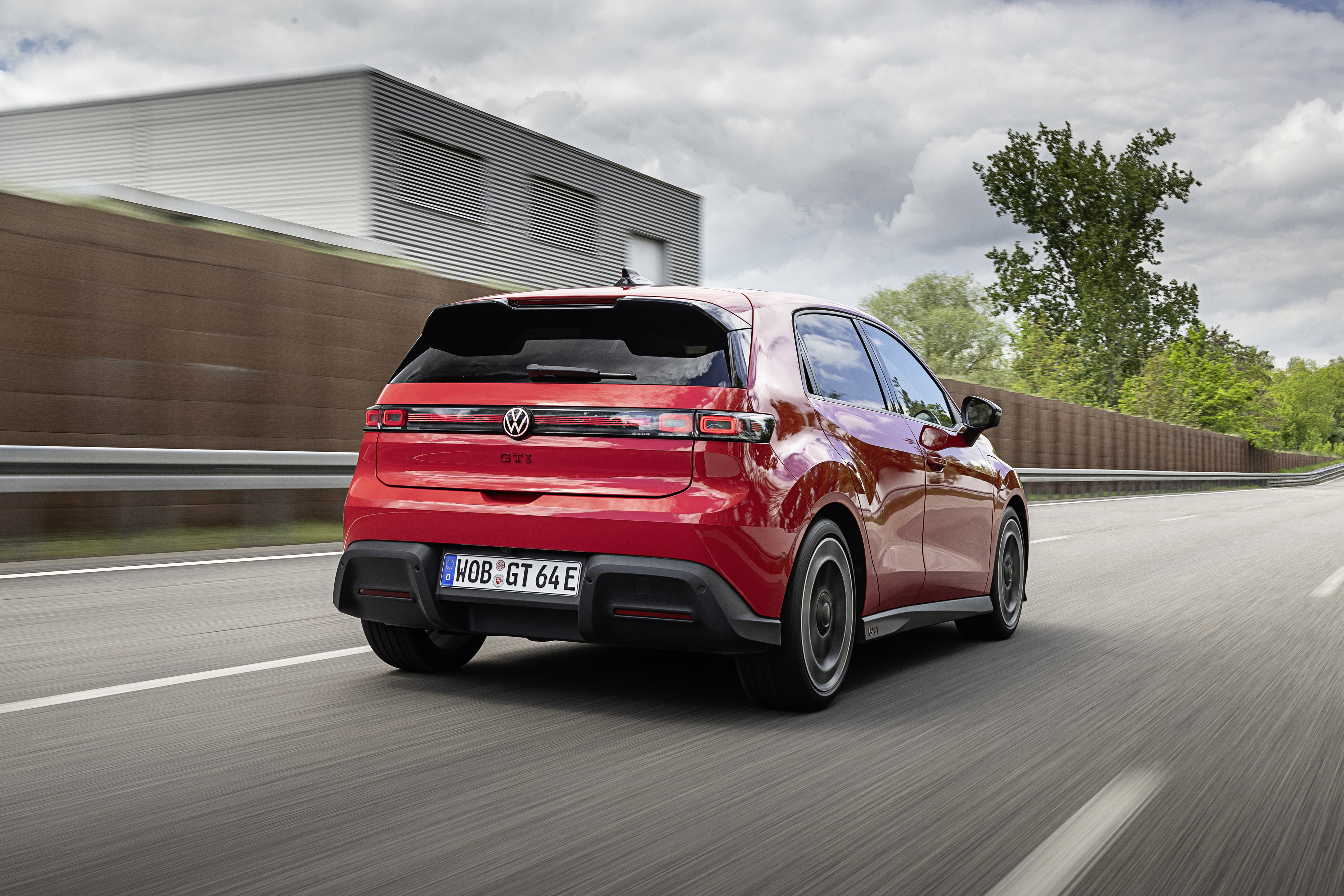 An electric VW ID. Polo GTI drives away from the camera