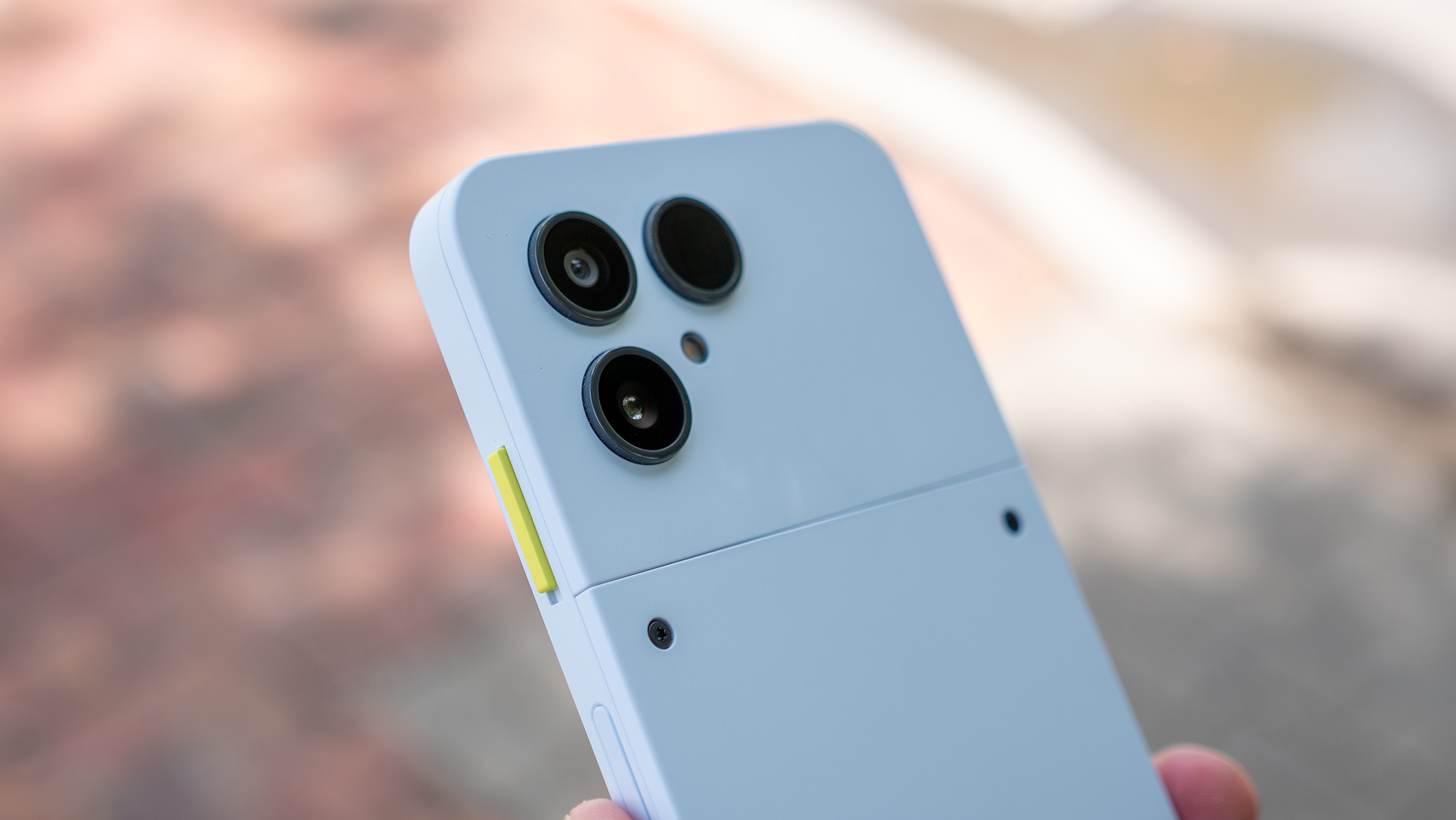 The colorful customizable side switch on the Fairphone 6