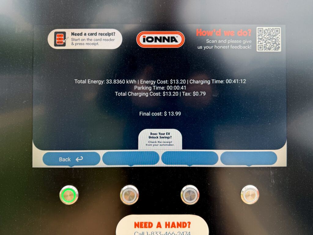 An IONNA charger screen showing $13.99 for 33.8 kWh.