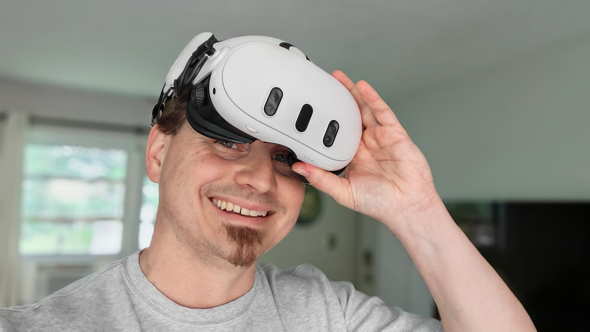 Smiling while pulling a Meta Quest 3 off my head