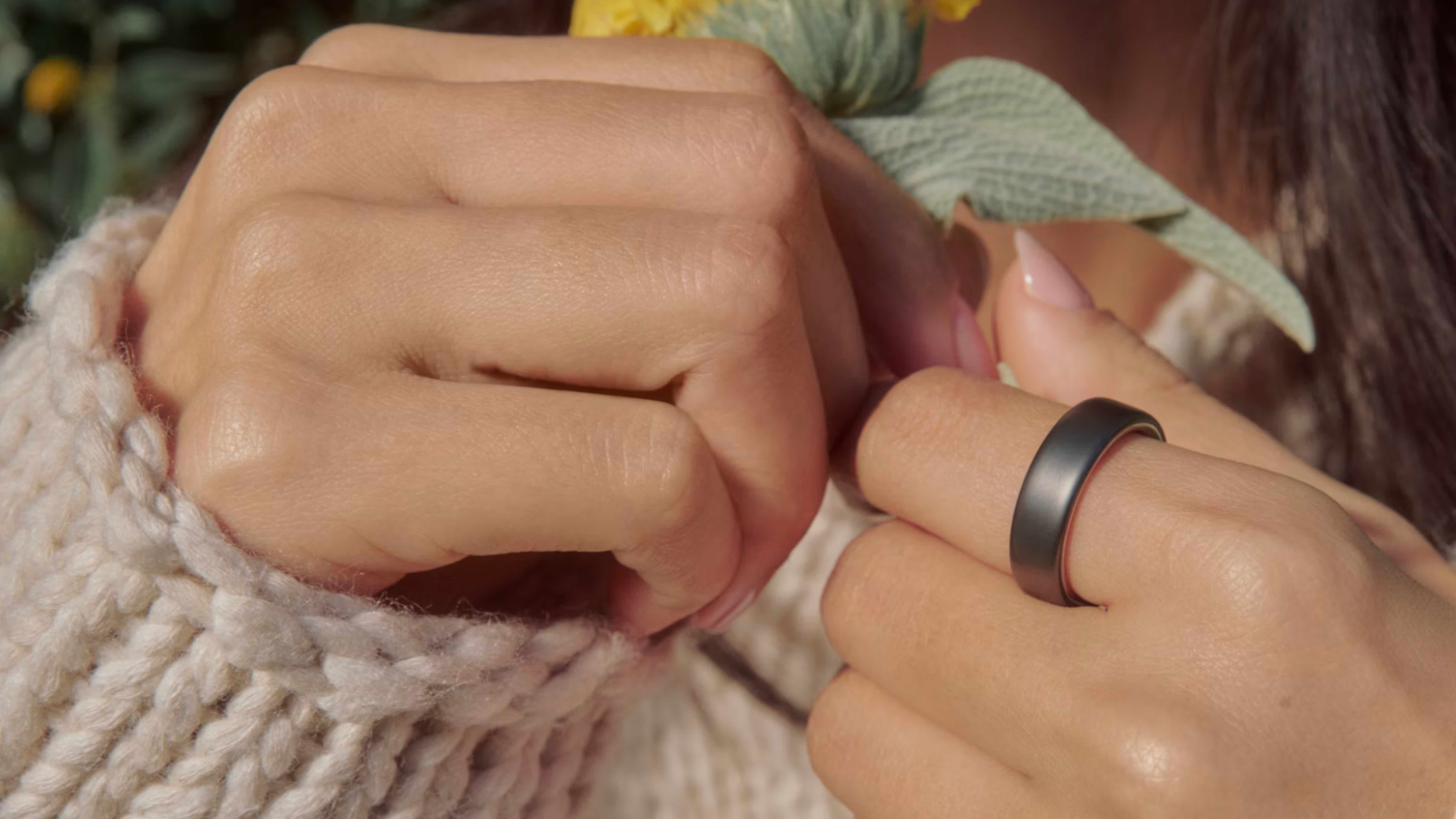 The Oura Ring 5 and companion app in lifestyle images.