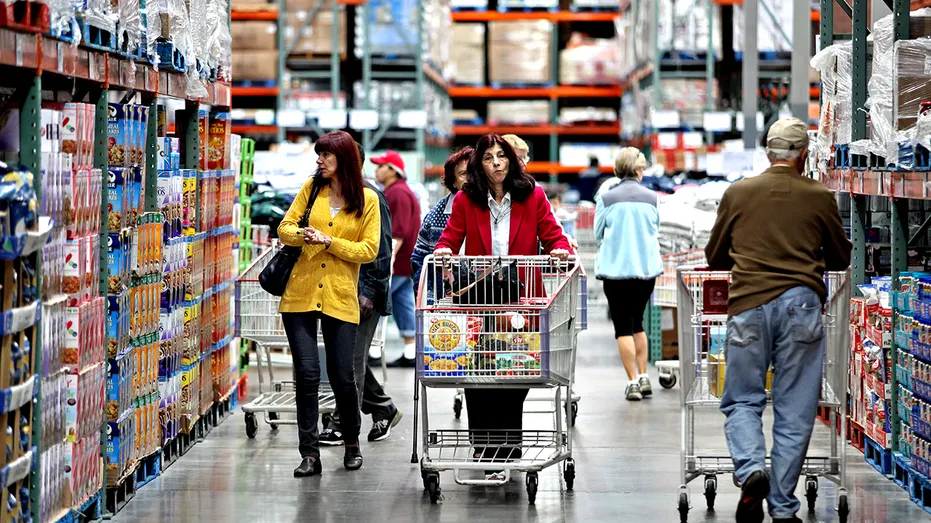 Shoppers walking aisle at Costco