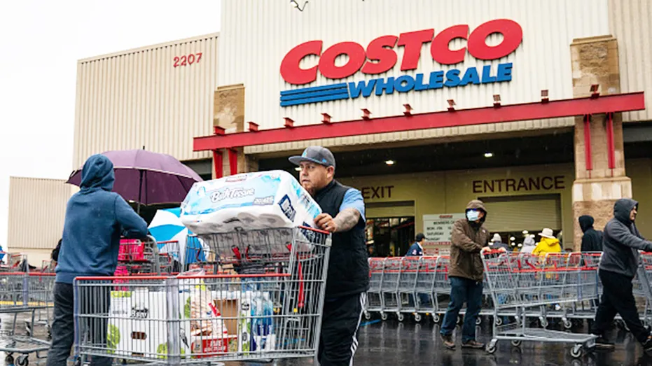 Costco shopper pushing cart outside warehouse