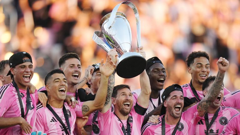 Lionel Messi lifts the MLS Cup 