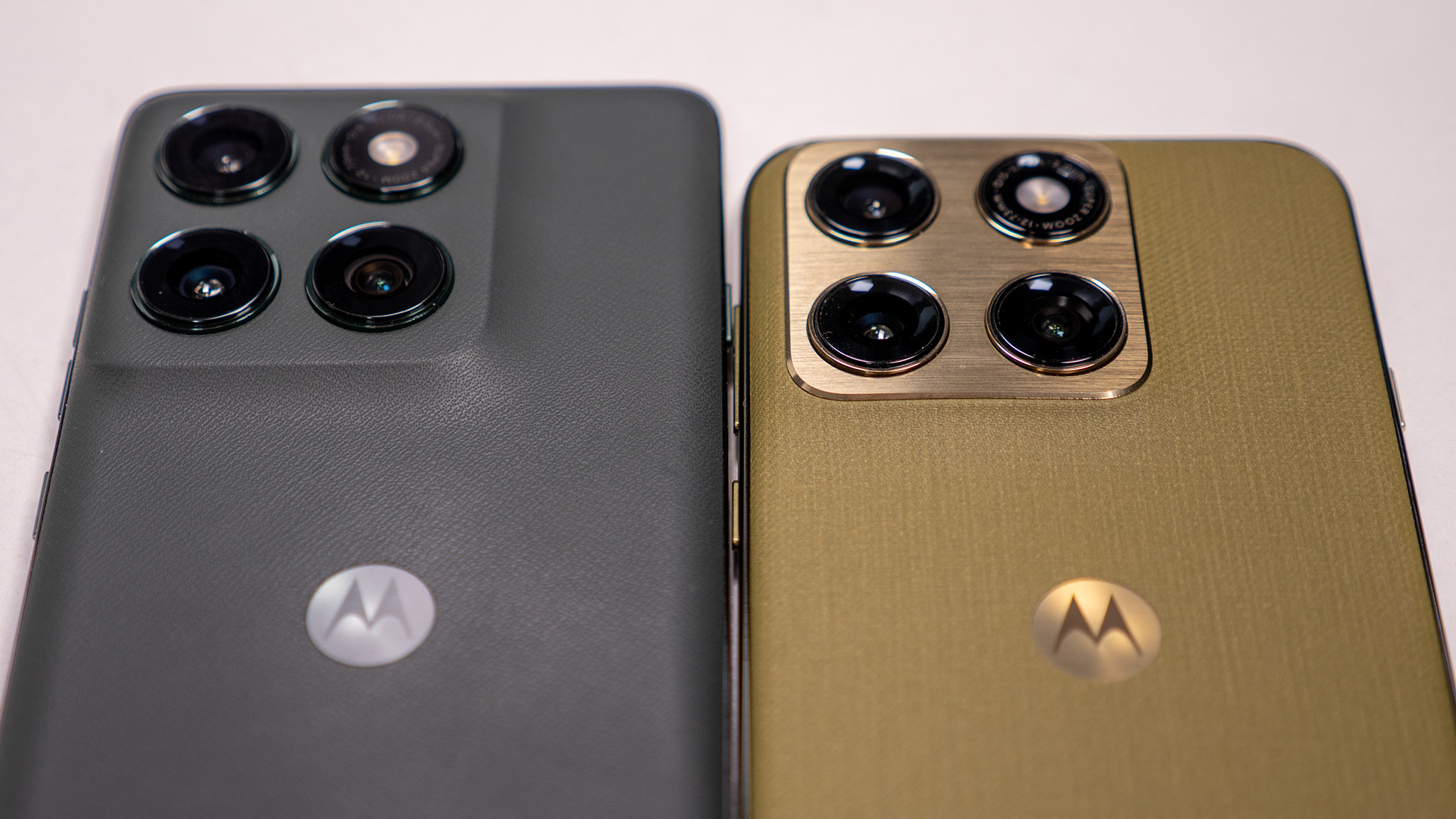 Comparing the olive green Motorola Edge 2026's design with the dark grey Motorola Edge 2025