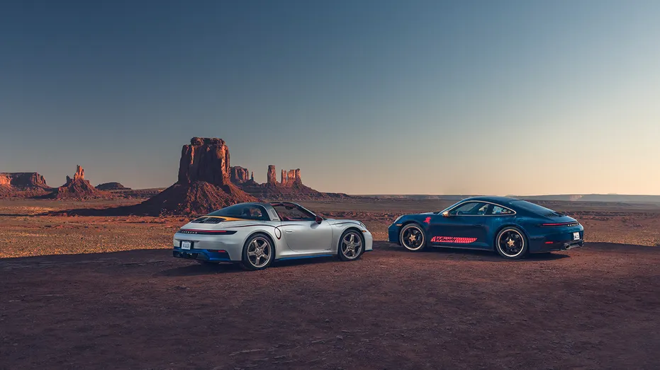 A Jessie-inspired Porsche 911 Targa 4 GTS and Woody-inspired Porsche 911 Carrera T are shown in a desert setting.