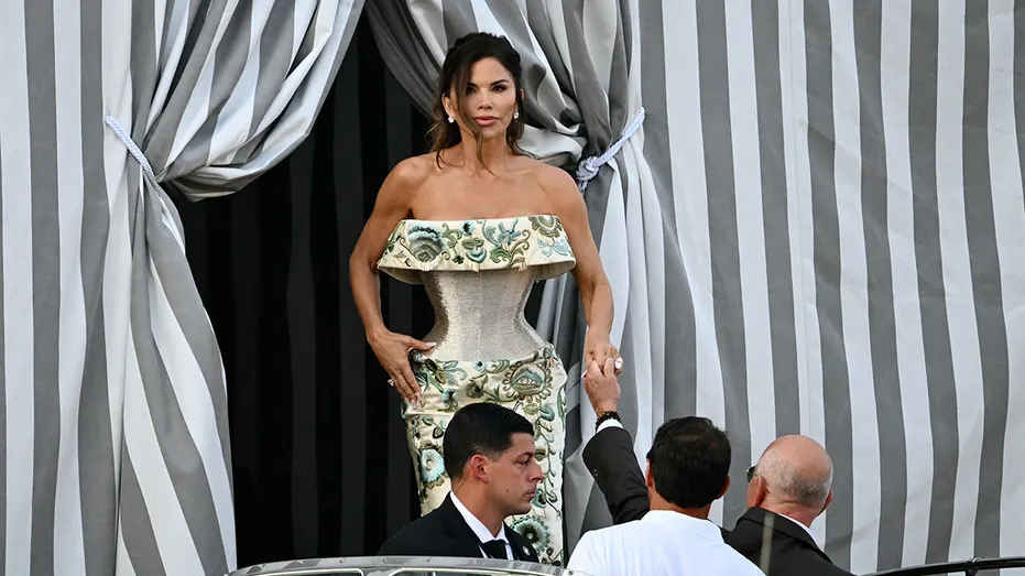 Amazon founder Jeff Bezos and Lauren Sanchez get on a taxi boat at the Aman Hotel in Venice on June 26, 2026. Celebrities in superyachts sail into Venice this week for the three-day wedding party of Amazon tycoon Jeff Bezos and Lauren Sanchez, despite irate locals who say the UNESCO city is no billionaire's playground. The tech magnate and journalist have reportedly invited about 200 guests to their multi-million dollar nuptials in the Italian city, which are expected to kick off on June 26 and end Saturday with a ceremony at a secret location. (Photo by Stefano Rellandini / AFP) (Photo by STEFANO RELLANDINI/AFP via Getty Images)