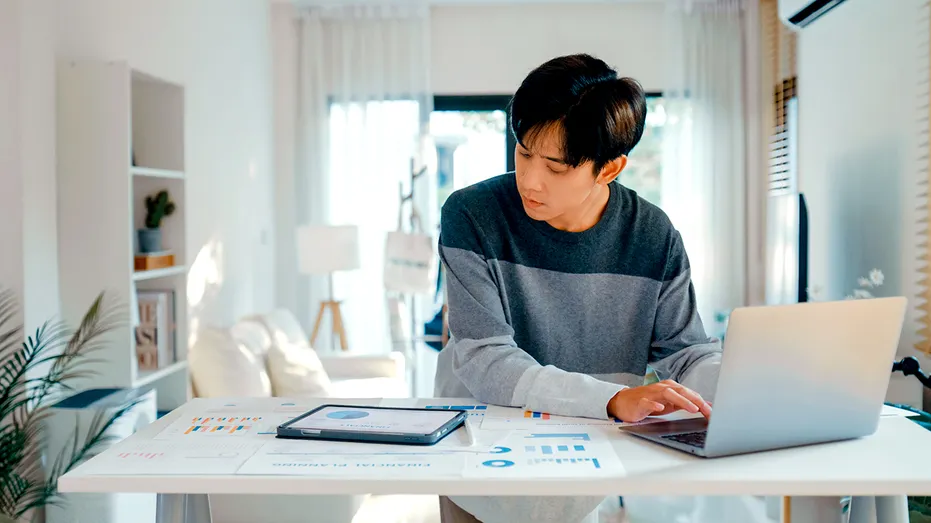 A young person at a desk.