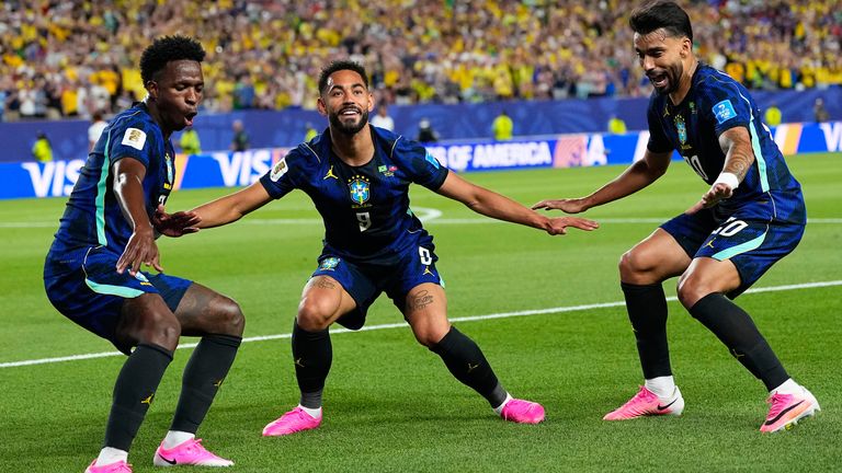 Brazil's Matheus Cunha (9) celebrates after scoring his side's second goal with Brazil's Vinicius Junior (7) and Lucas Paqueta (20) 
